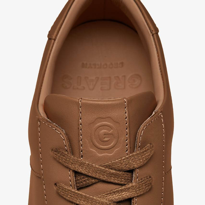 Brown sneakers with stripes