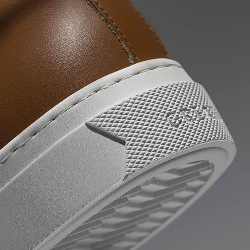 Brown sneakers with stripes